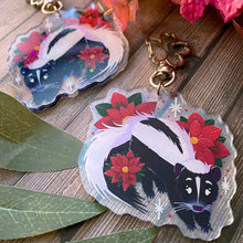 Load image into Gallery viewer, Poinsettia Skunk - 2.5&quot; holographic acrylic keychain
